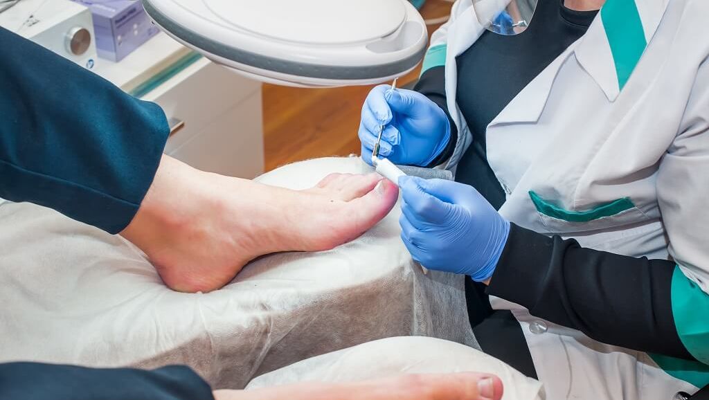 image of our Foot Specialists looking at an foot